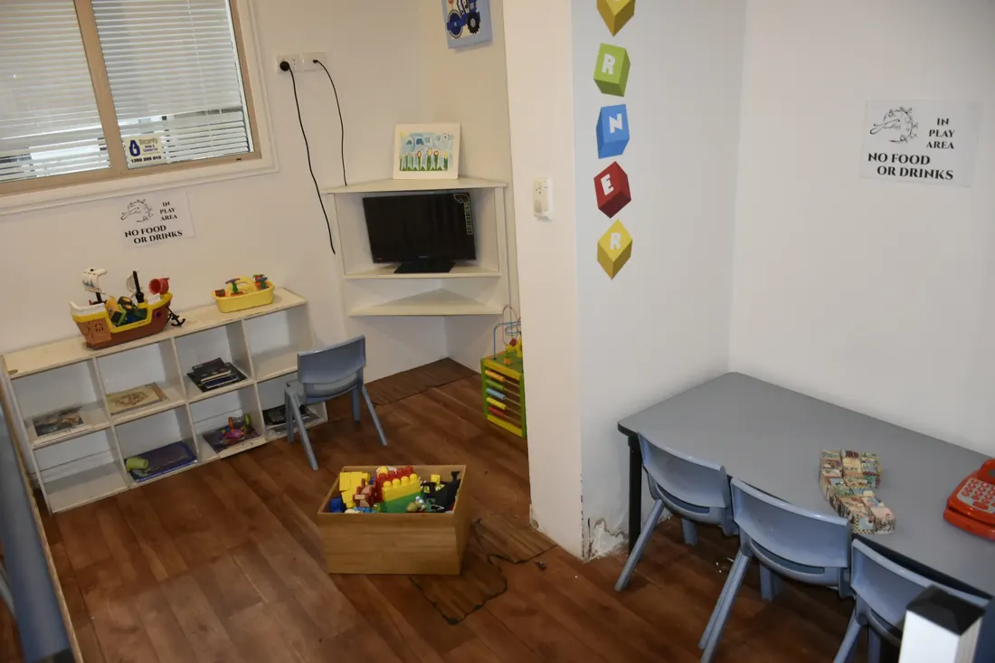 The kids’ play corner with toys and a small table